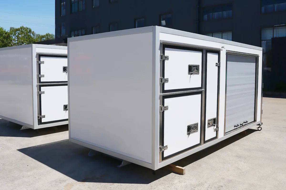 Multi-temperature zone refrigerated truck body with separate insulated compartments